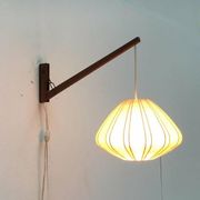 Mid-century pivoting wall lamp with a swing arm, Cocoon, made of teak wood, 1960s.