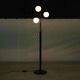 Minimalist floor lamp in glass, space age style.