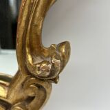 Wooden mirror with gilded stucco