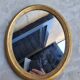 Golden oval mirror 34x28cm