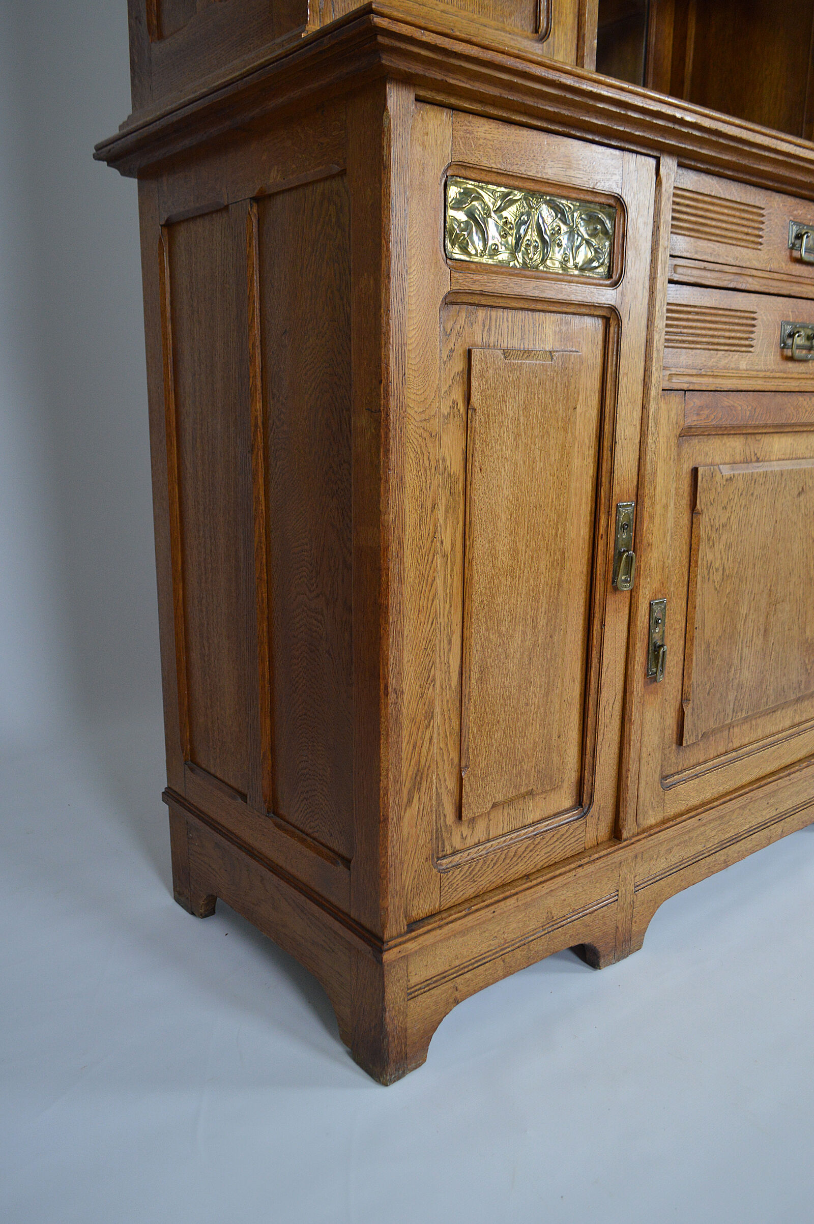 Art Nouveau oak buffet and dinanderie panels, circa 1910