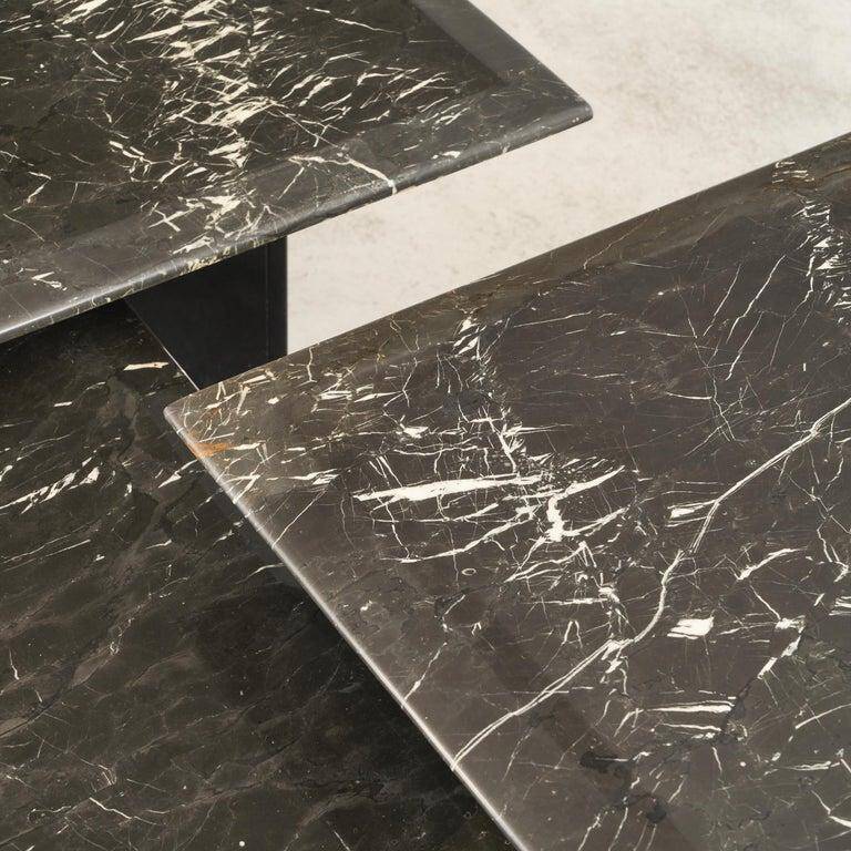 Set of 3 marble and lacquer coffee tables, 1970s.