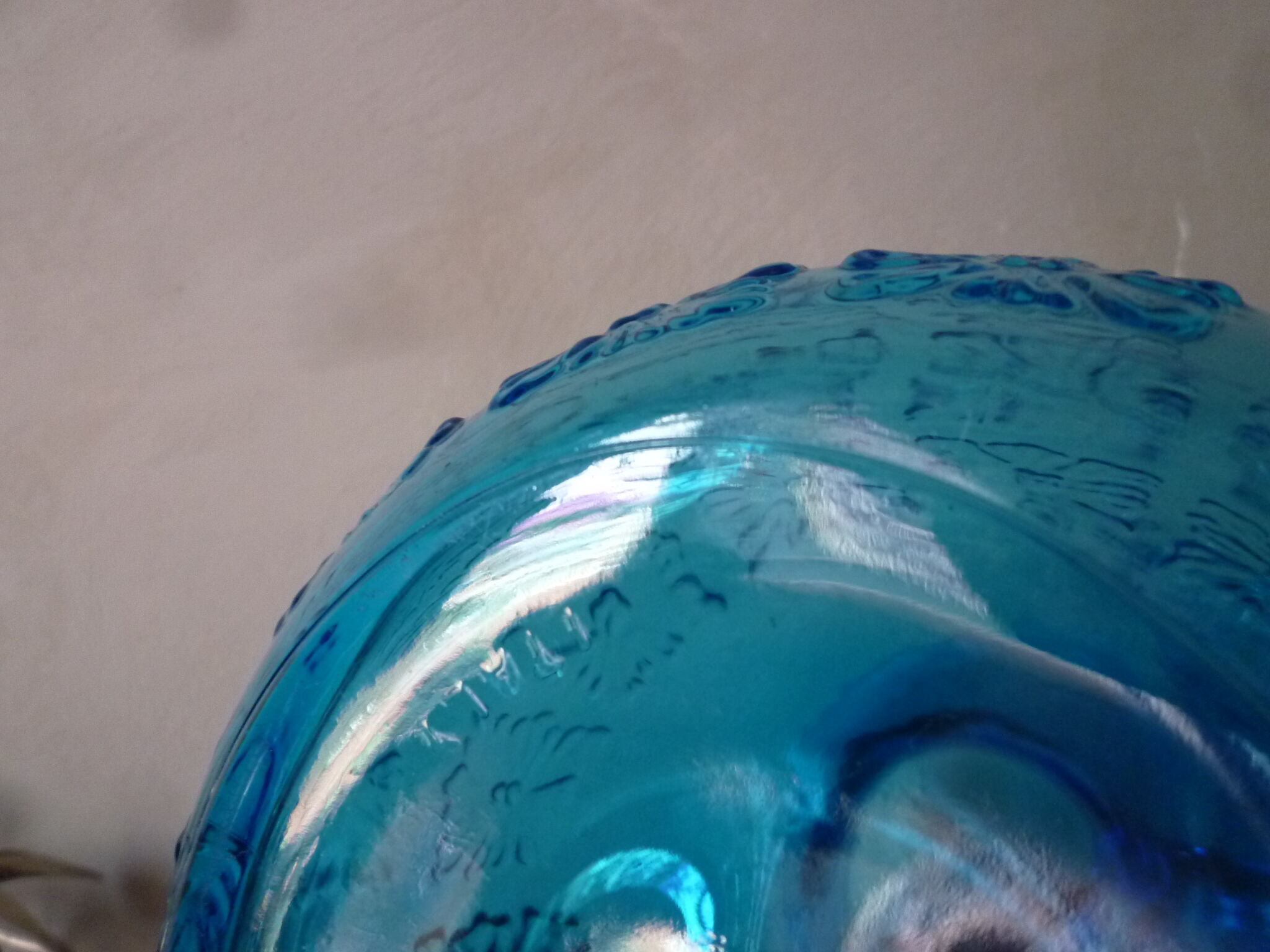 Blue glass carafe and two glasses
