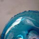 Blue glass carafe and two glasses