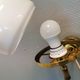Older wall lamp, in metal, brass and milk-white glass