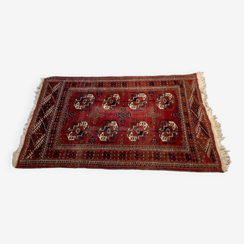 Red wool carpet, geometric pattern.