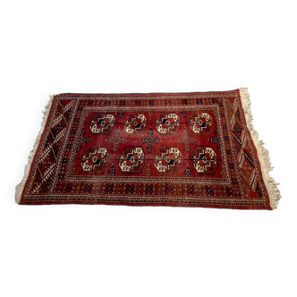 Red wool carpet, geometric pattern.
