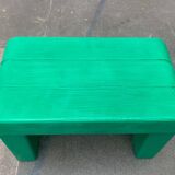 Postmodern plastic stool with a wood effect.