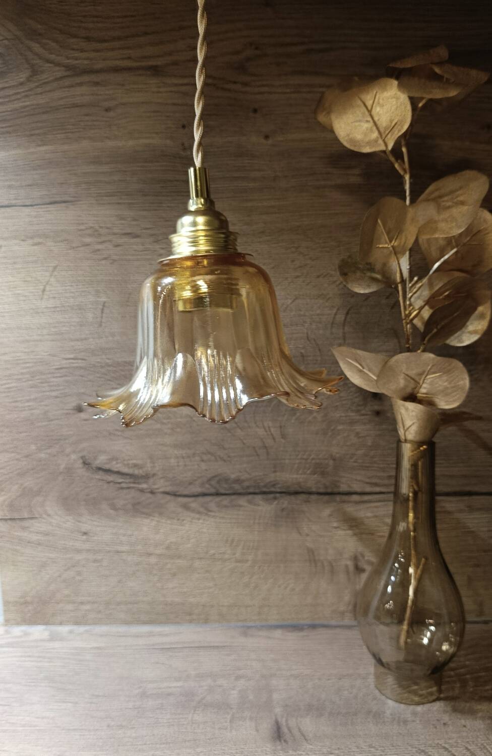 Amber tulip glass portable lamp, golden braided cord.