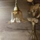 Amber tulip glass portable lamp, golden braided cord.