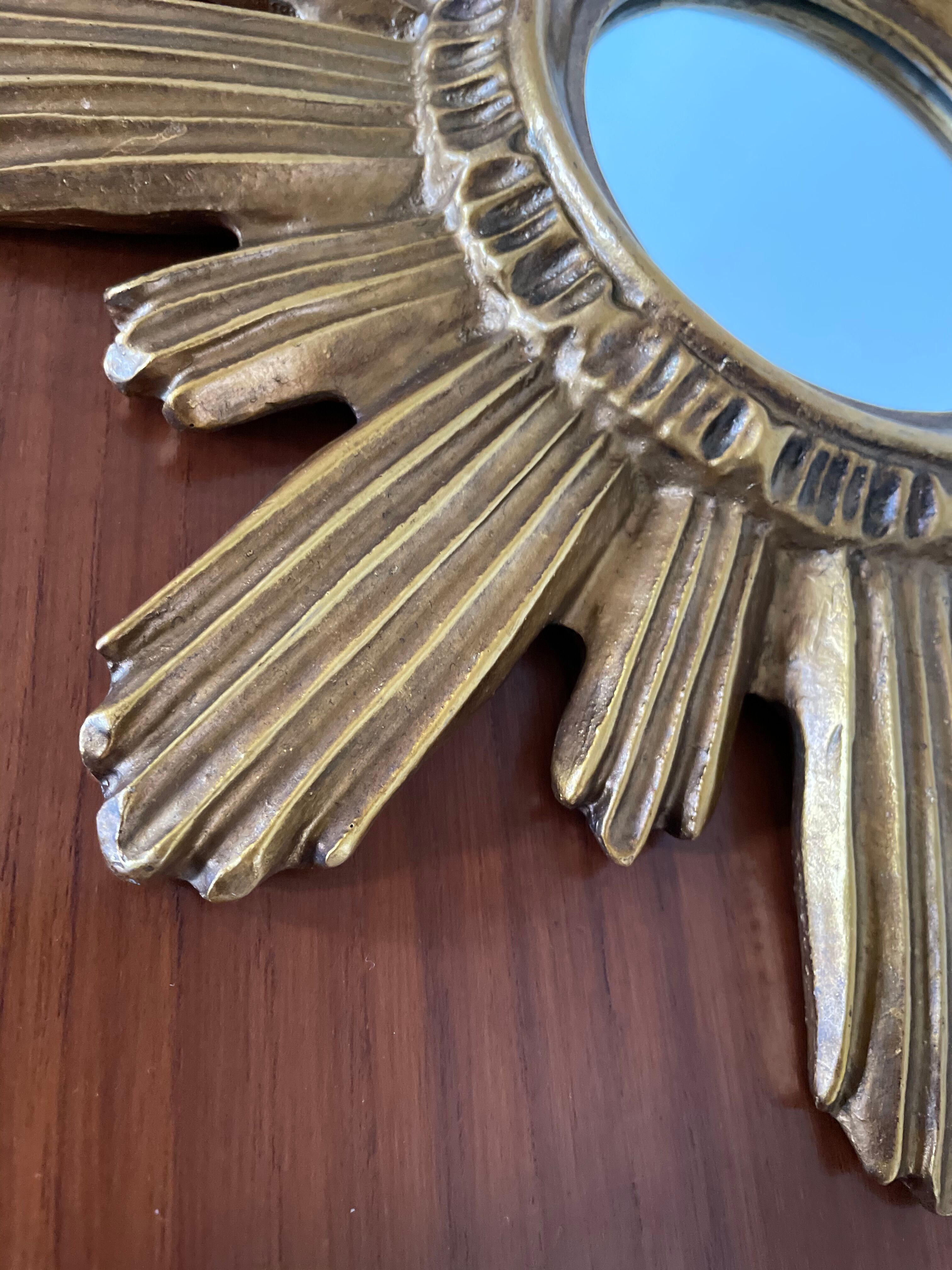 Vintage sun mirror in 60s/70s gold resin