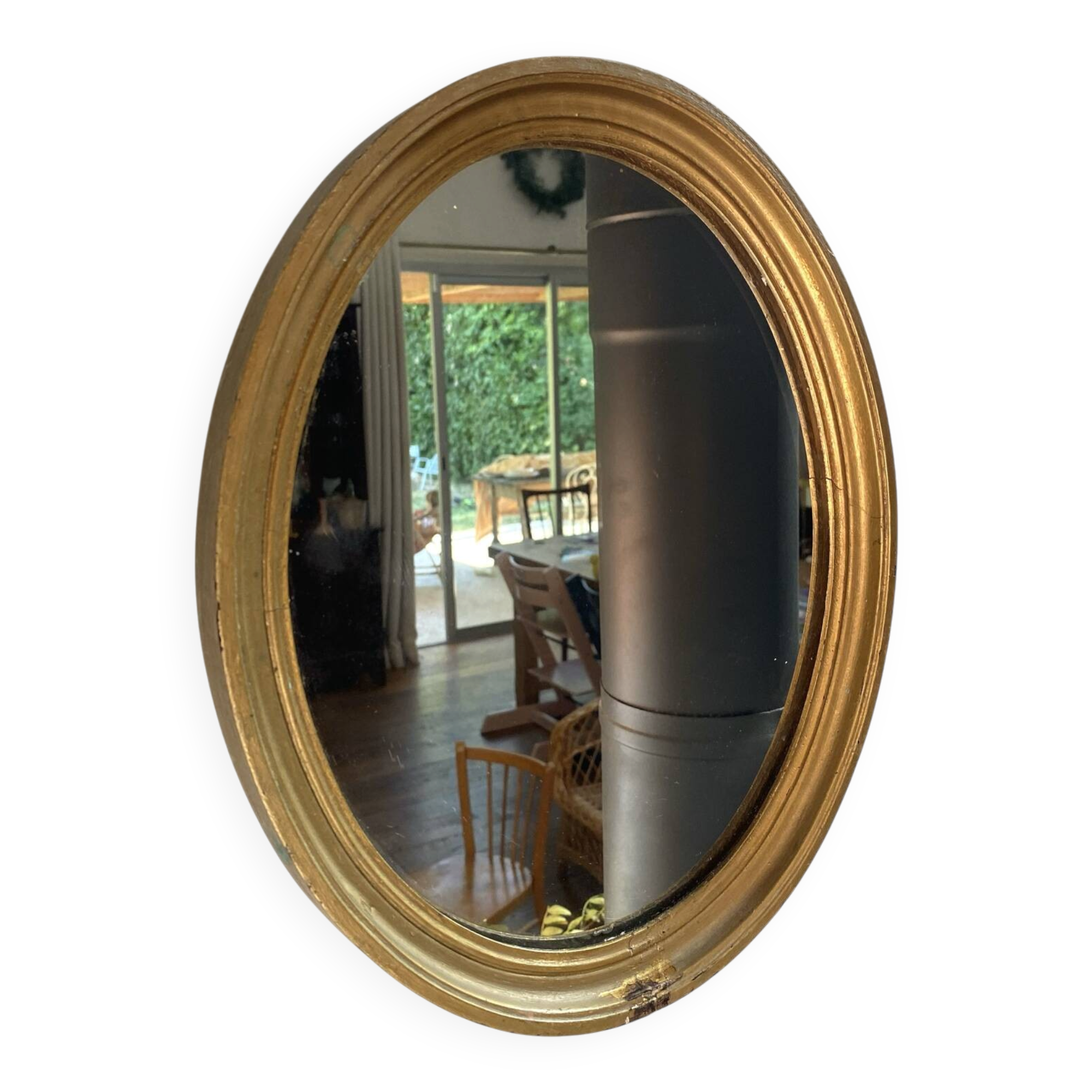 Oval mirror in gilded wood