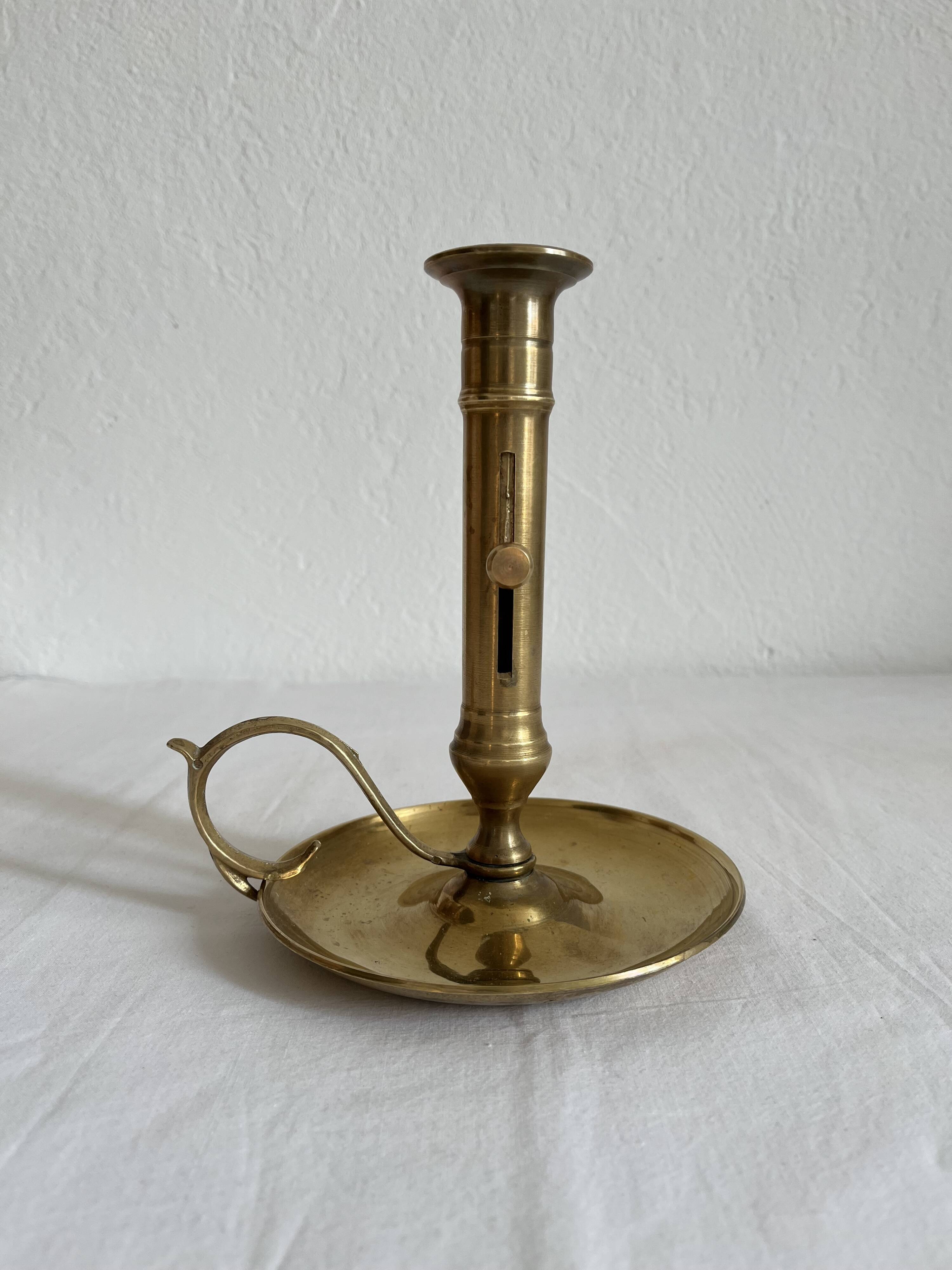 Vintage brass high hand candle holder