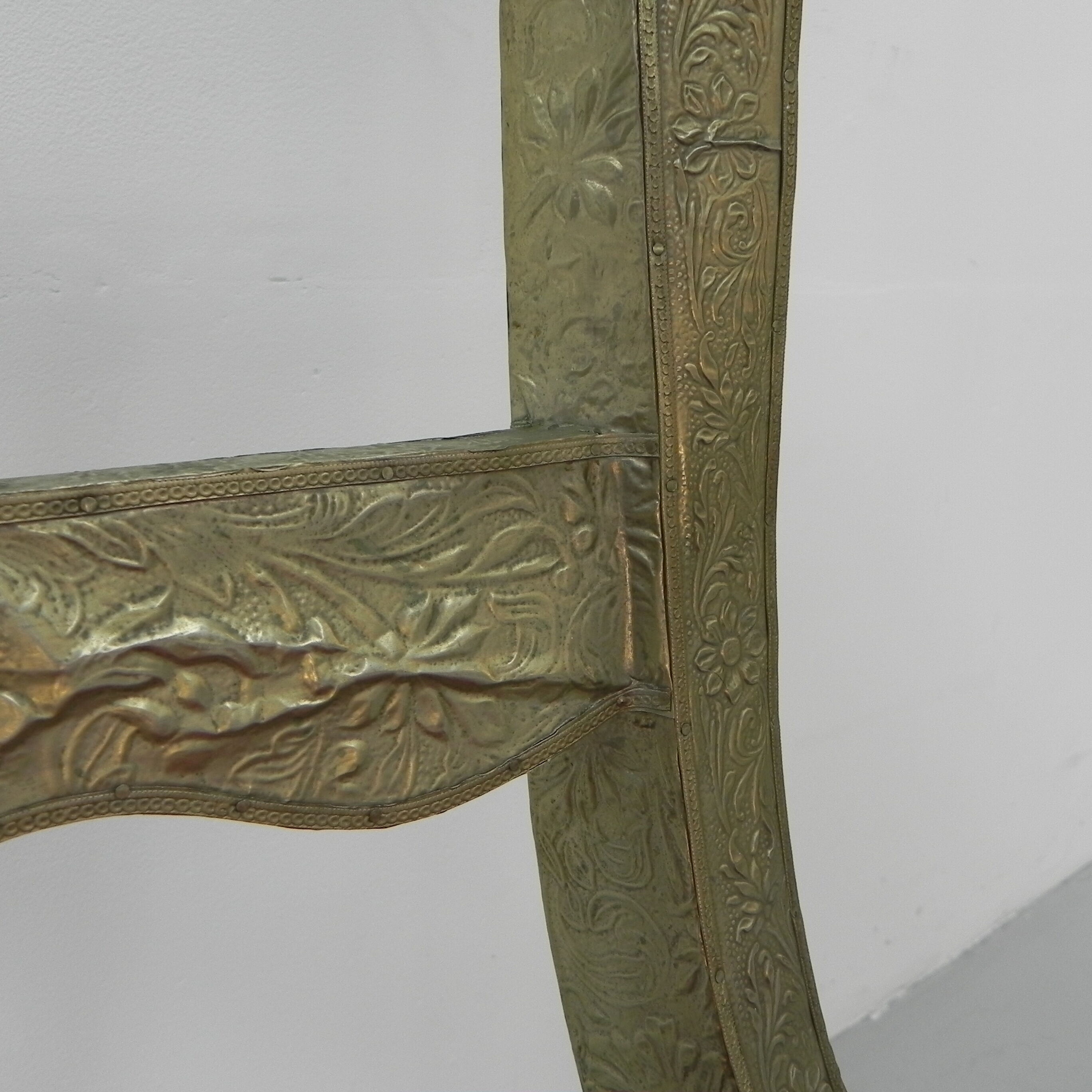 Dining chair upholstered with stamped tin