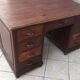 Vintage double-sided mahogany desk with 18 drawers.