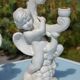 Pair of "cherub" candle holders in plaster