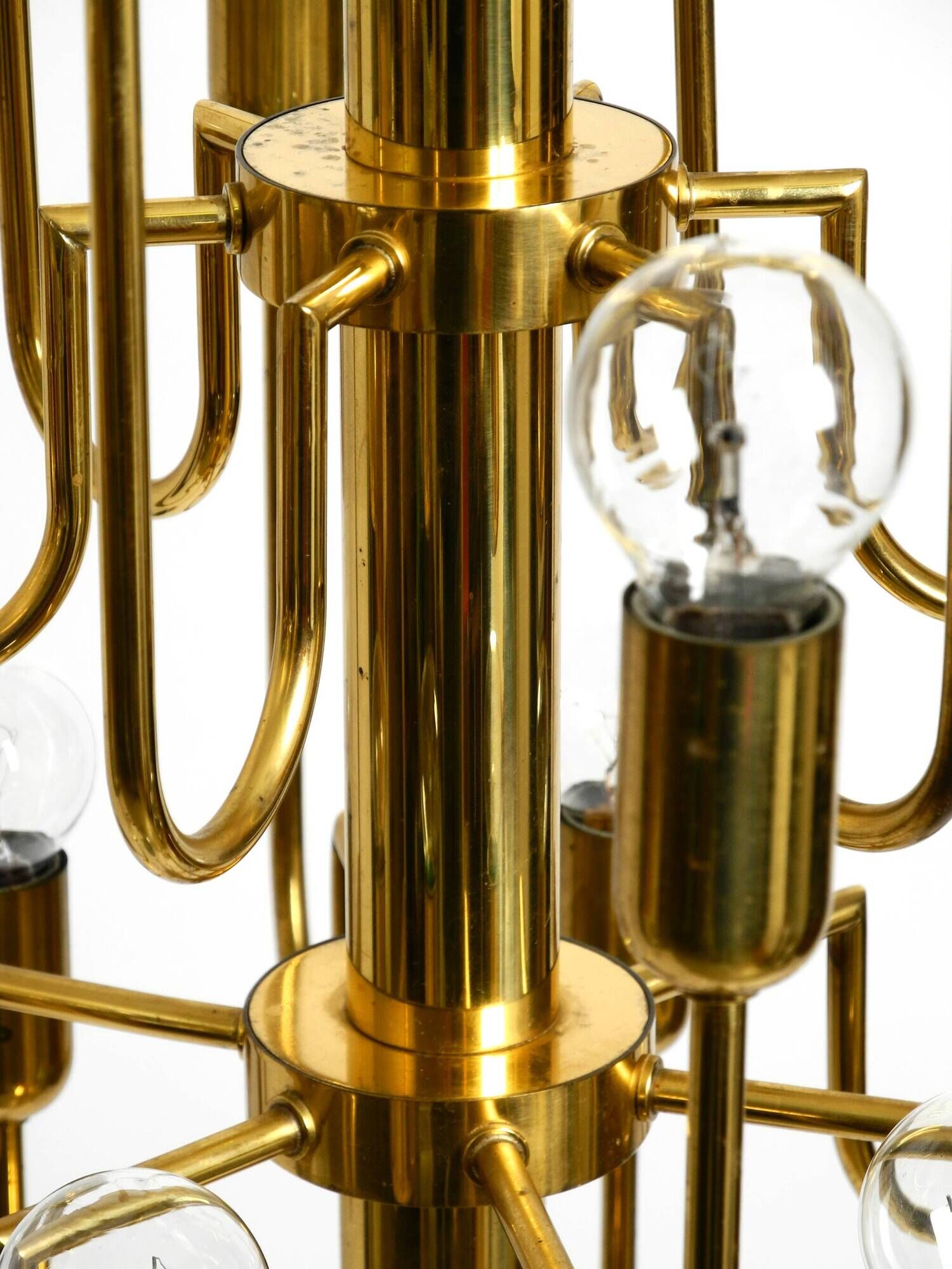 Three staged 18 arm Mid Century brass chandelier with a long brass rod