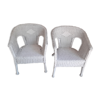 2 white wicker armchairs