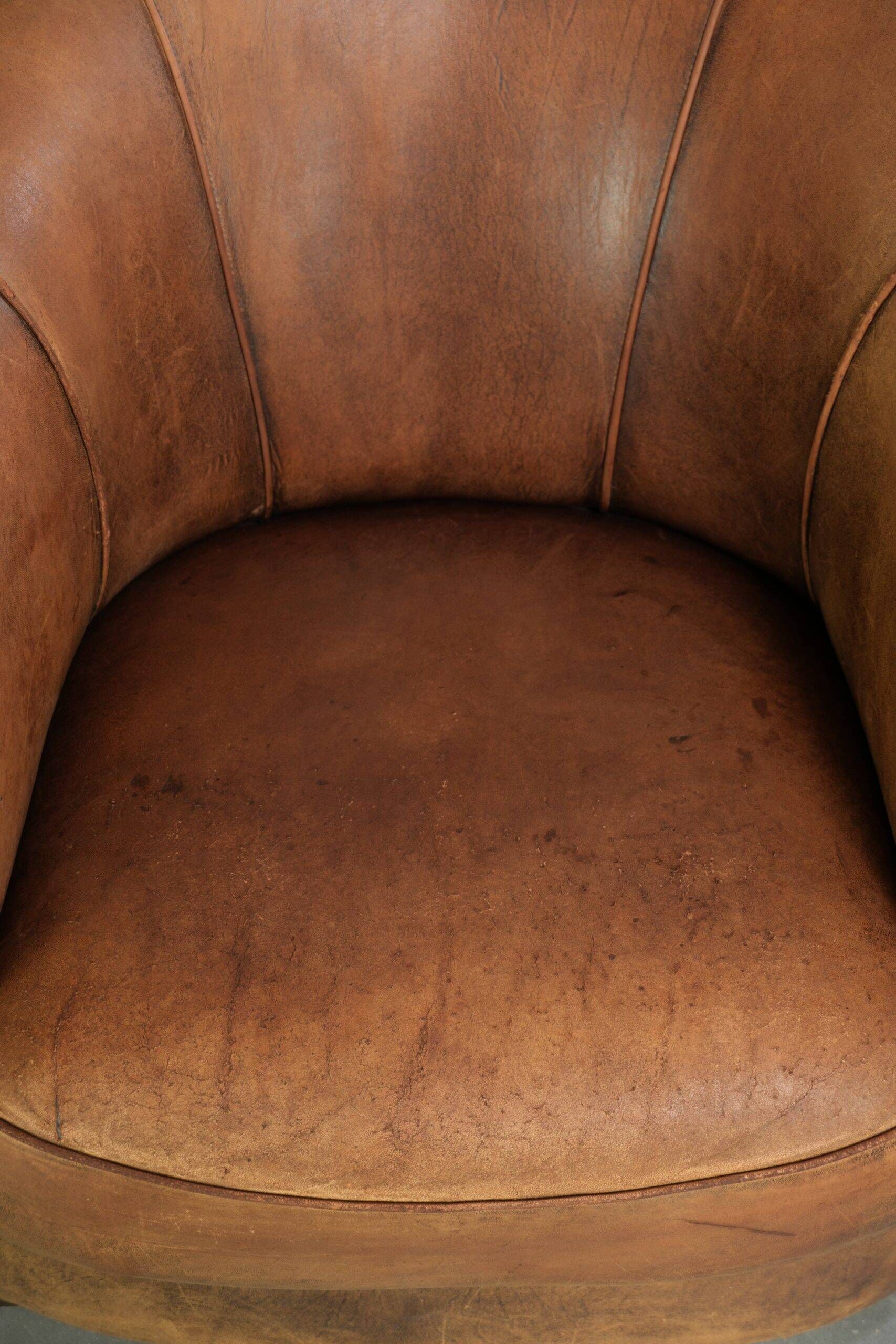 Vintage sheepskin clubchair in a beautiful cognac colour with a sturdy look