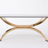 Gold Colored Mid-Century Modern coffee table with smoked Glass top