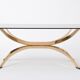 Gold Colored Mid-Century Modern coffee table with smoked Glass top