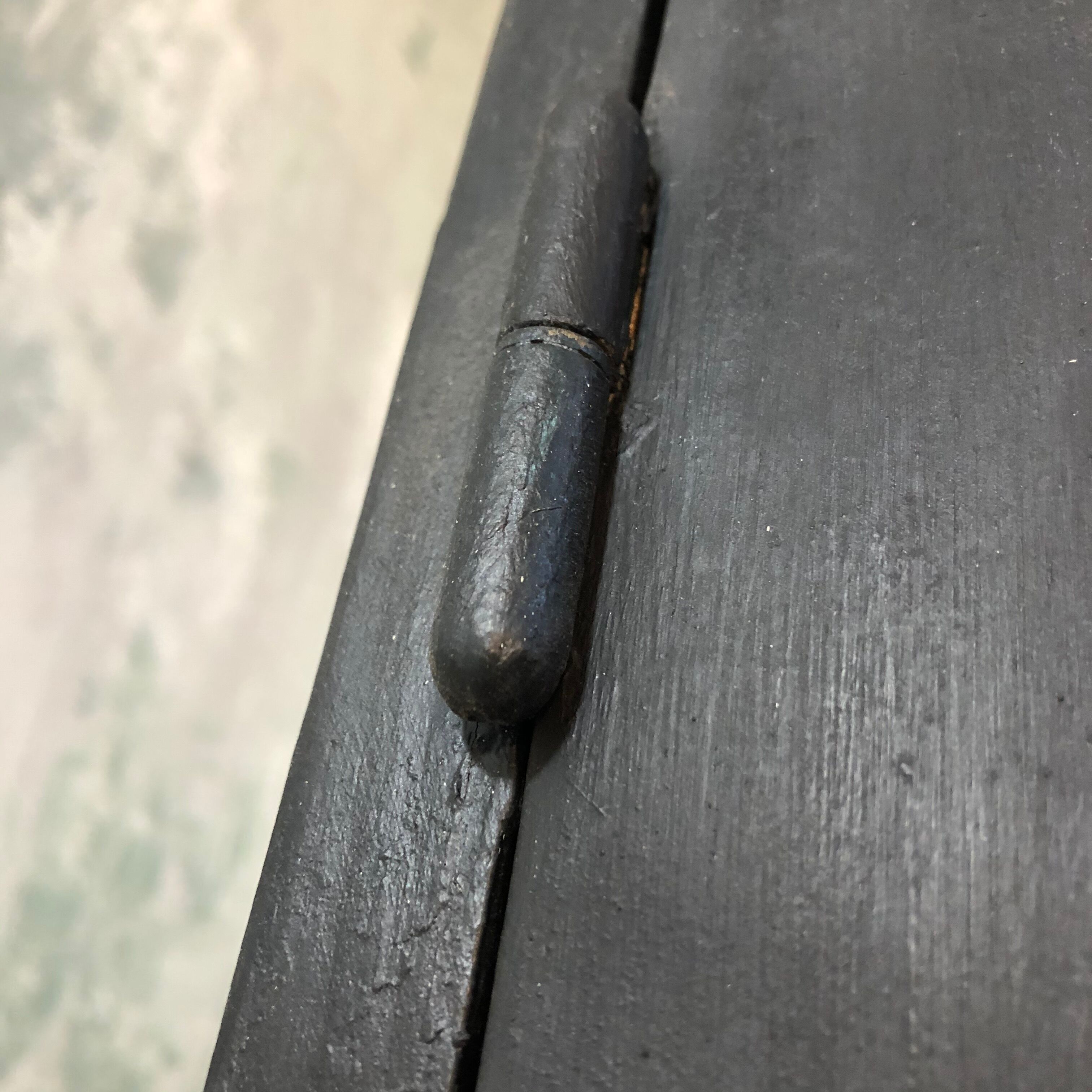 Former black painted wood workshop showcase