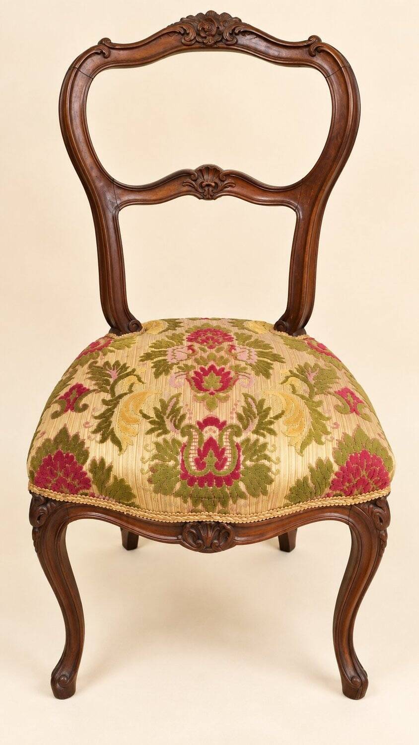 Carved walnut Napoleon III style velvet medallion chair