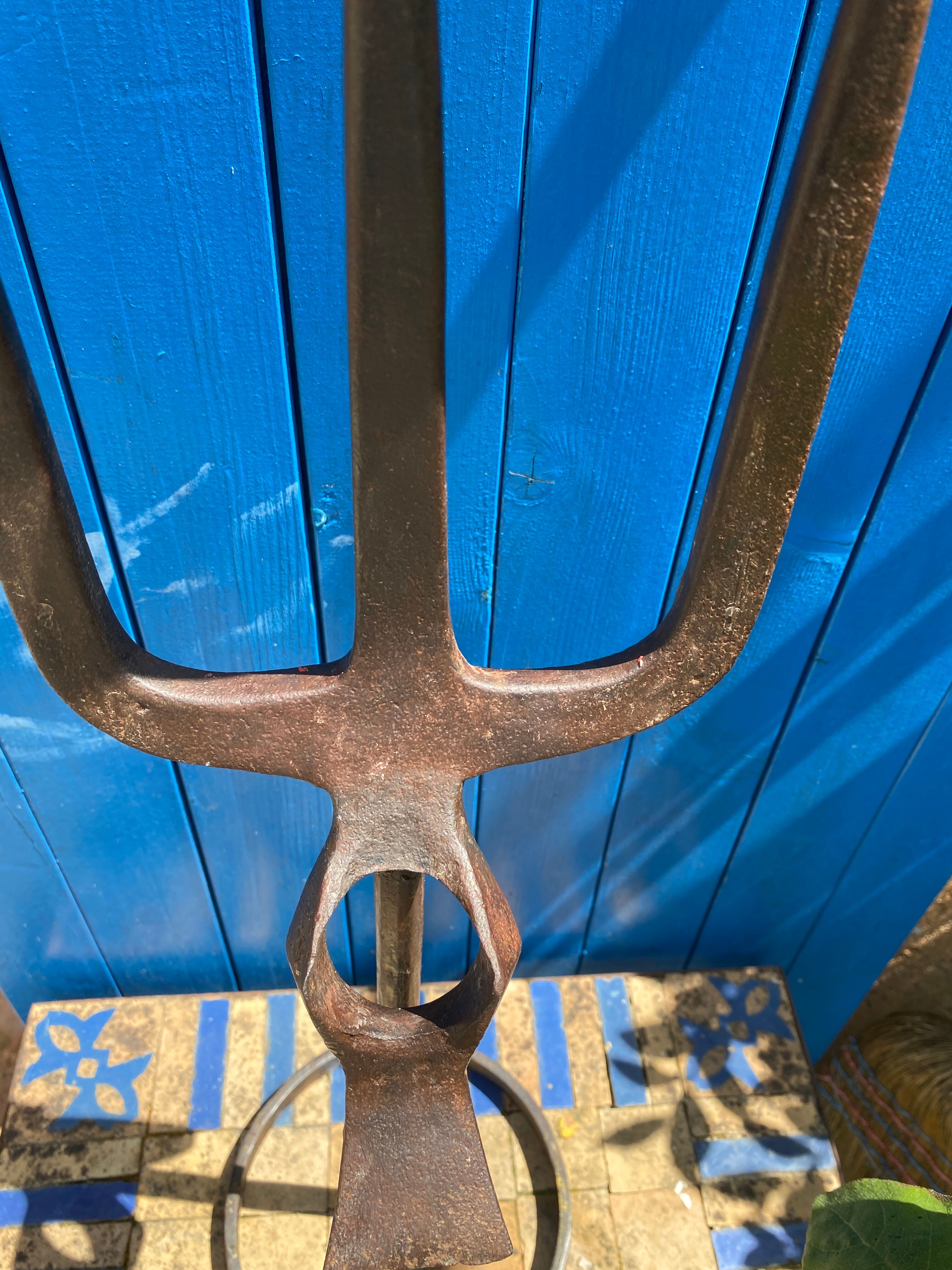 Brutalist iron candlestick on a stand