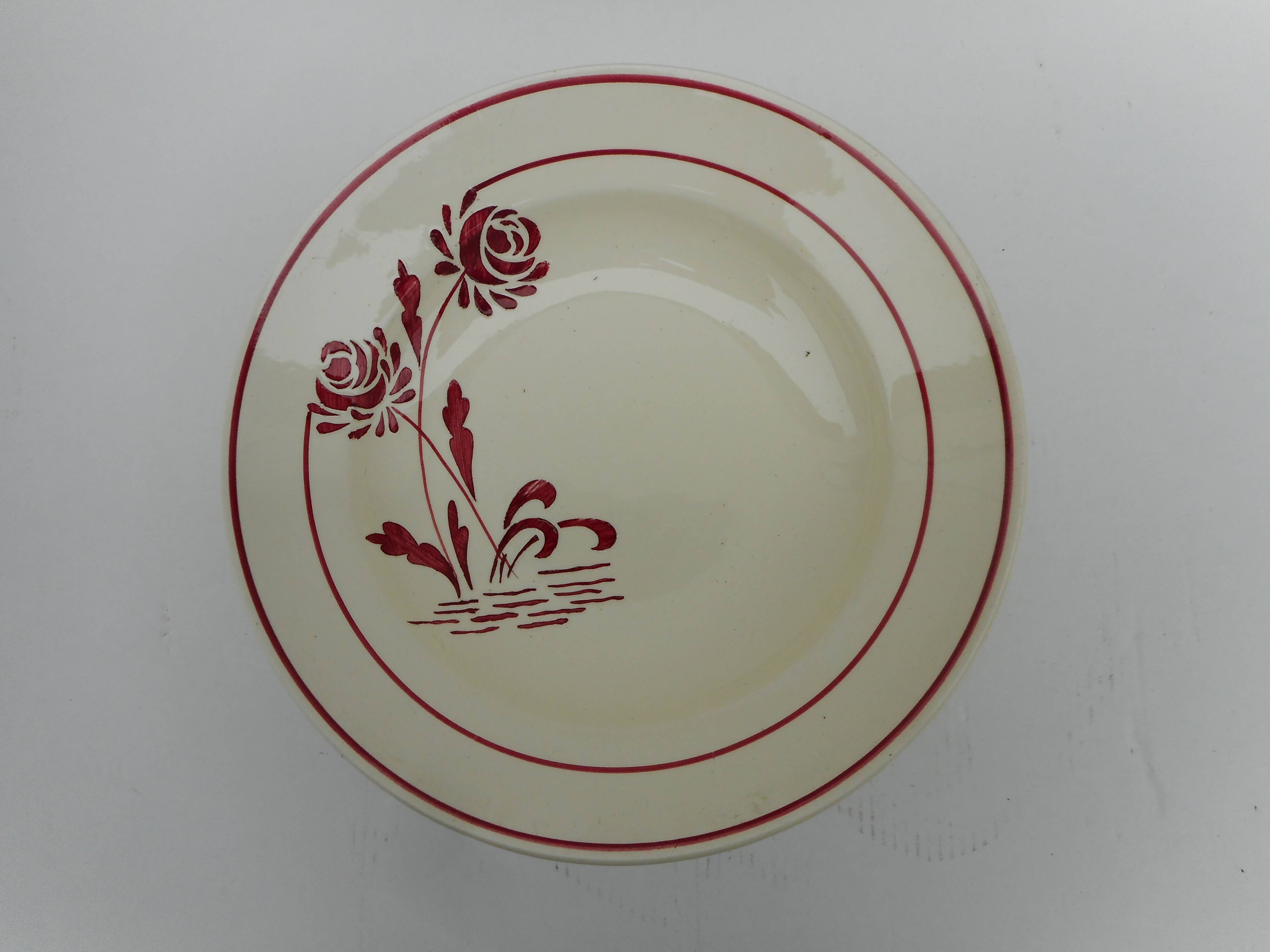 Six hollow earthenware plates