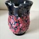 Vintage pitcher in midnight blue glazed ceramic with bright pink relief