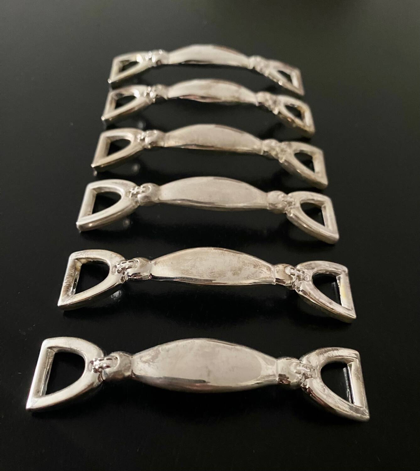 6 Silea knife holders in silver-colored metal stirrup shape