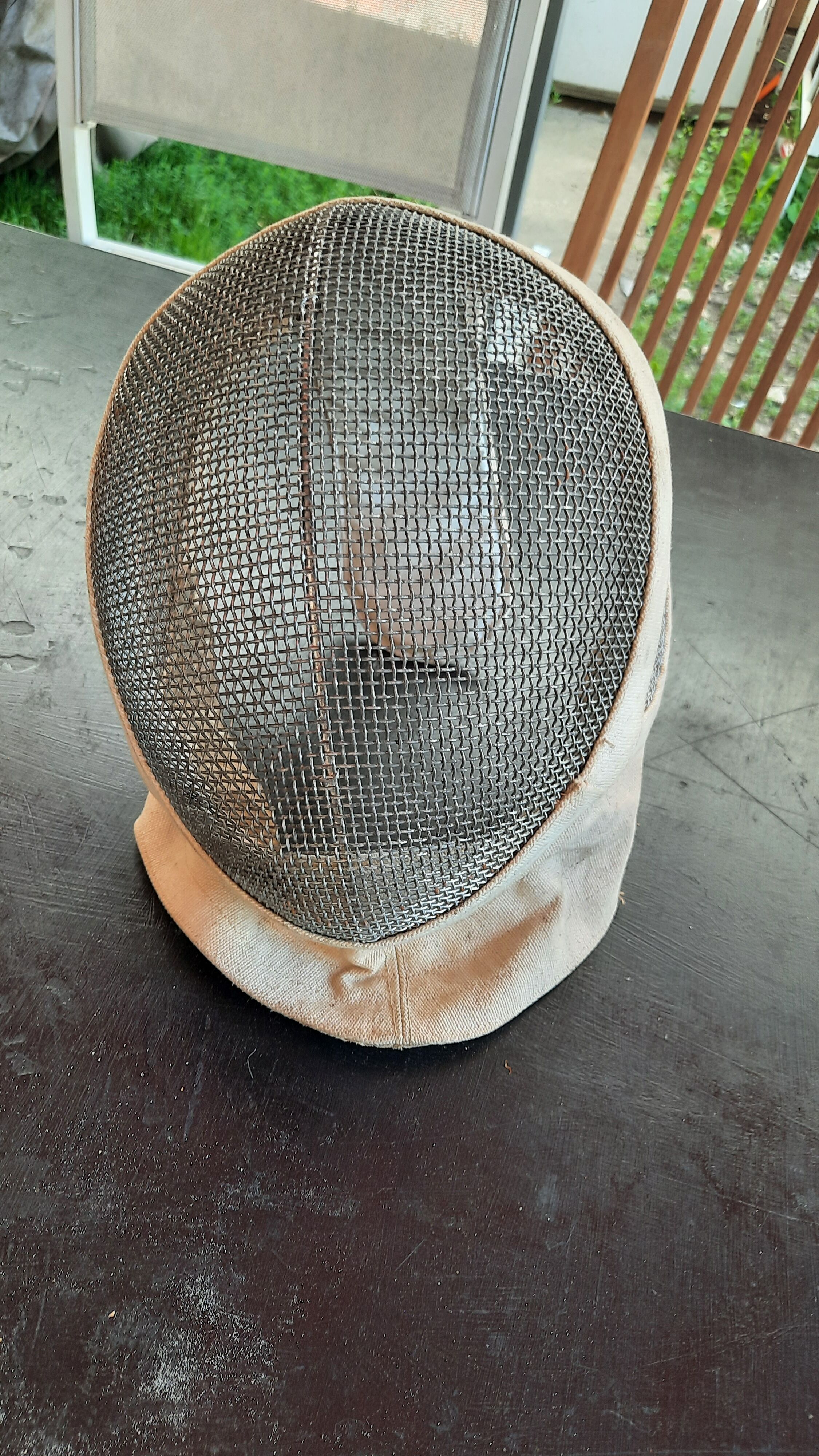 Pair of old fencing mask and foil