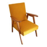 Curly yellow Scandinavian armchair