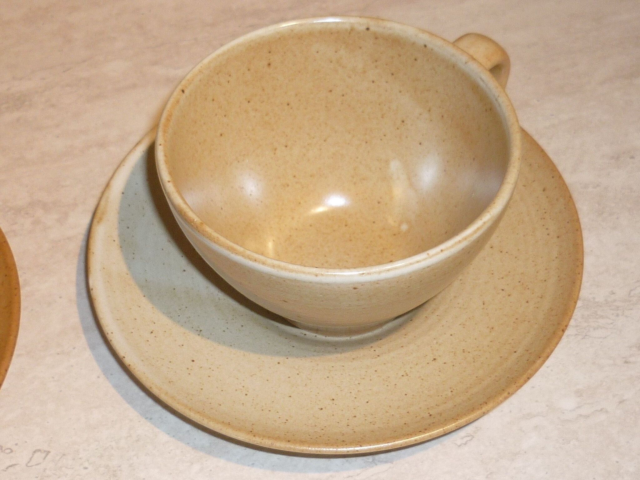 CNP Village stoneware cups and sub-cups