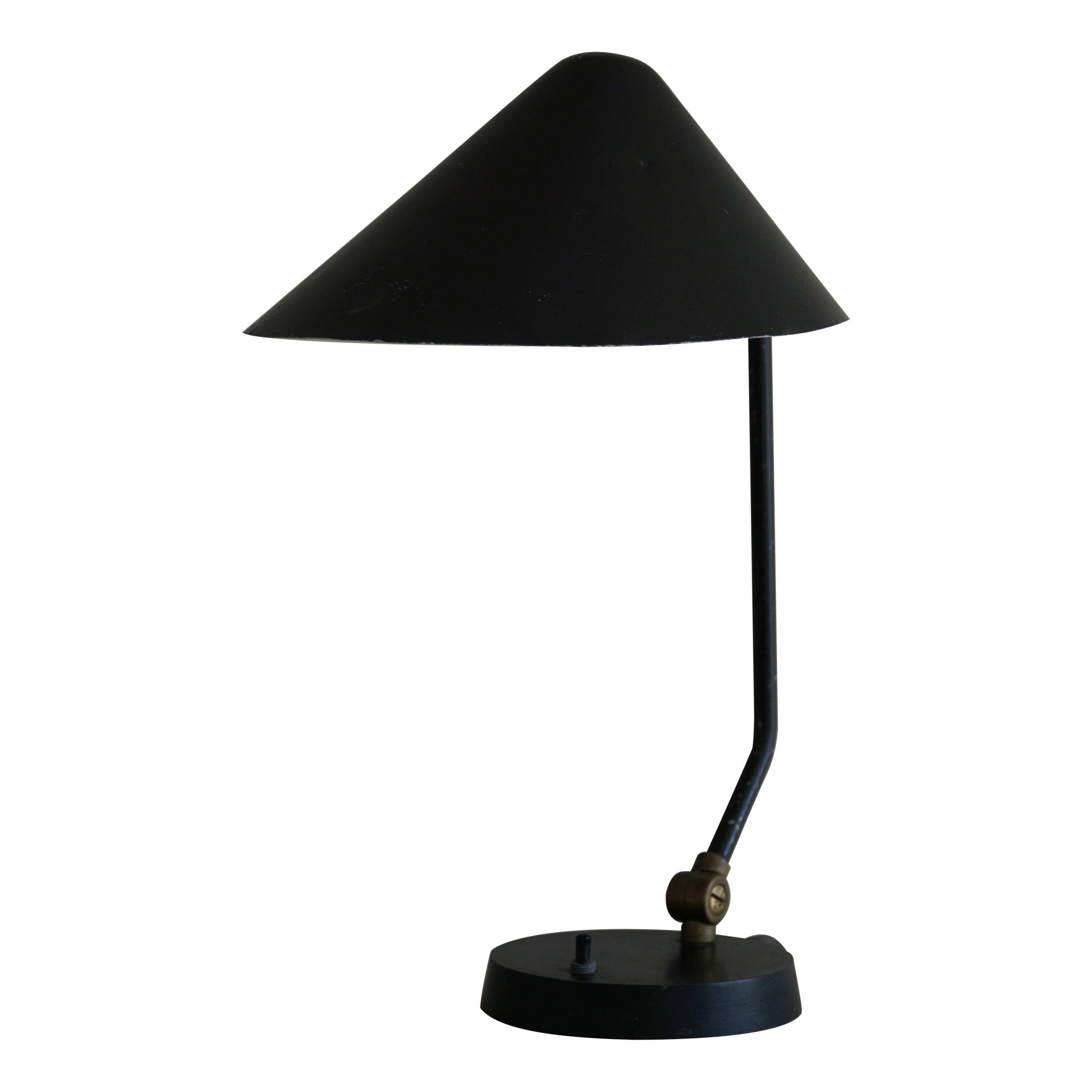 Modern adjustable Danish table lamp in metal, made by Louis Poulsen, 1950s.