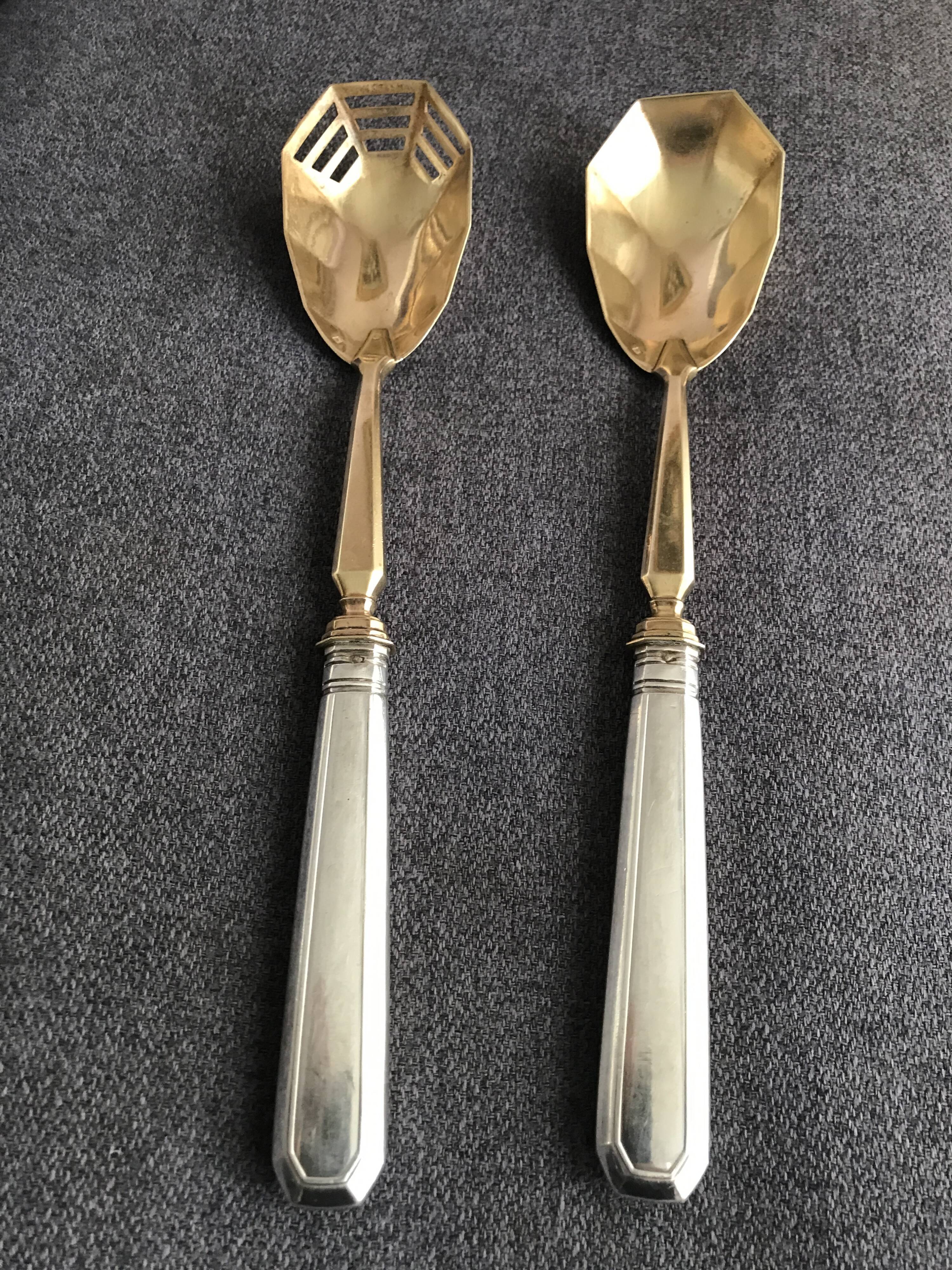 Pair of serving spoons in silver hallmark neck brace