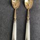 Pair of serving spoons in silver hallmark neck brace
