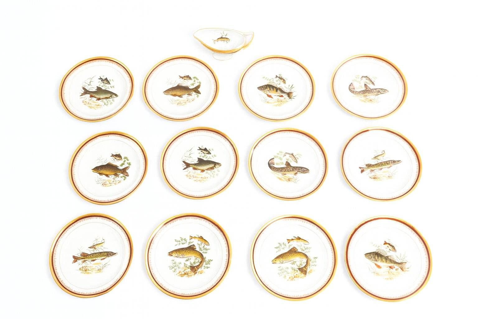 Porcelain plates and fish decoration sauce boat from Limoges, 1980s, set of 13.