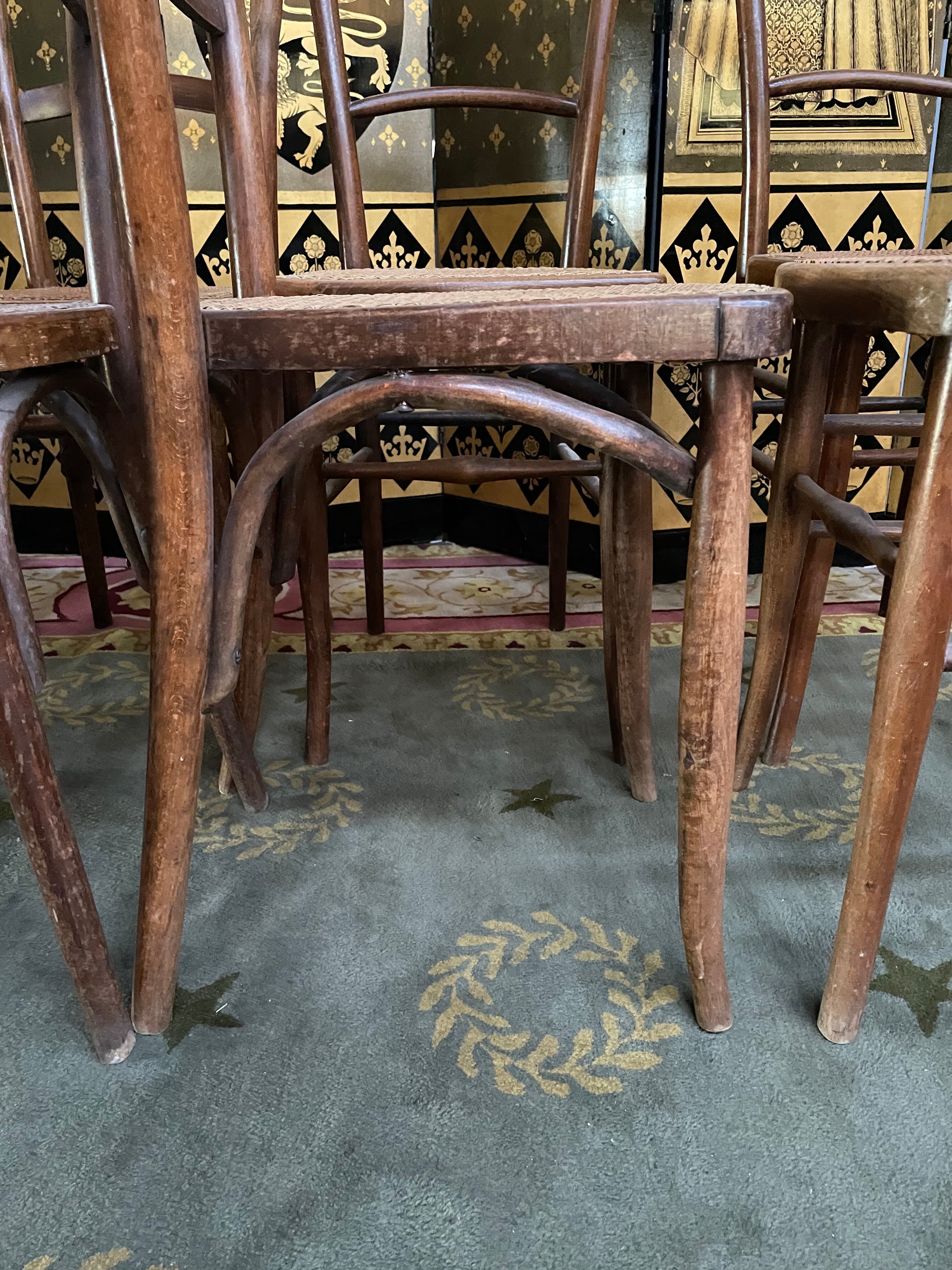 Suite of 10 bistro chairs in cannage