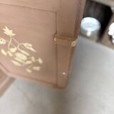 Large antique wardrobe painted with floral decoration.