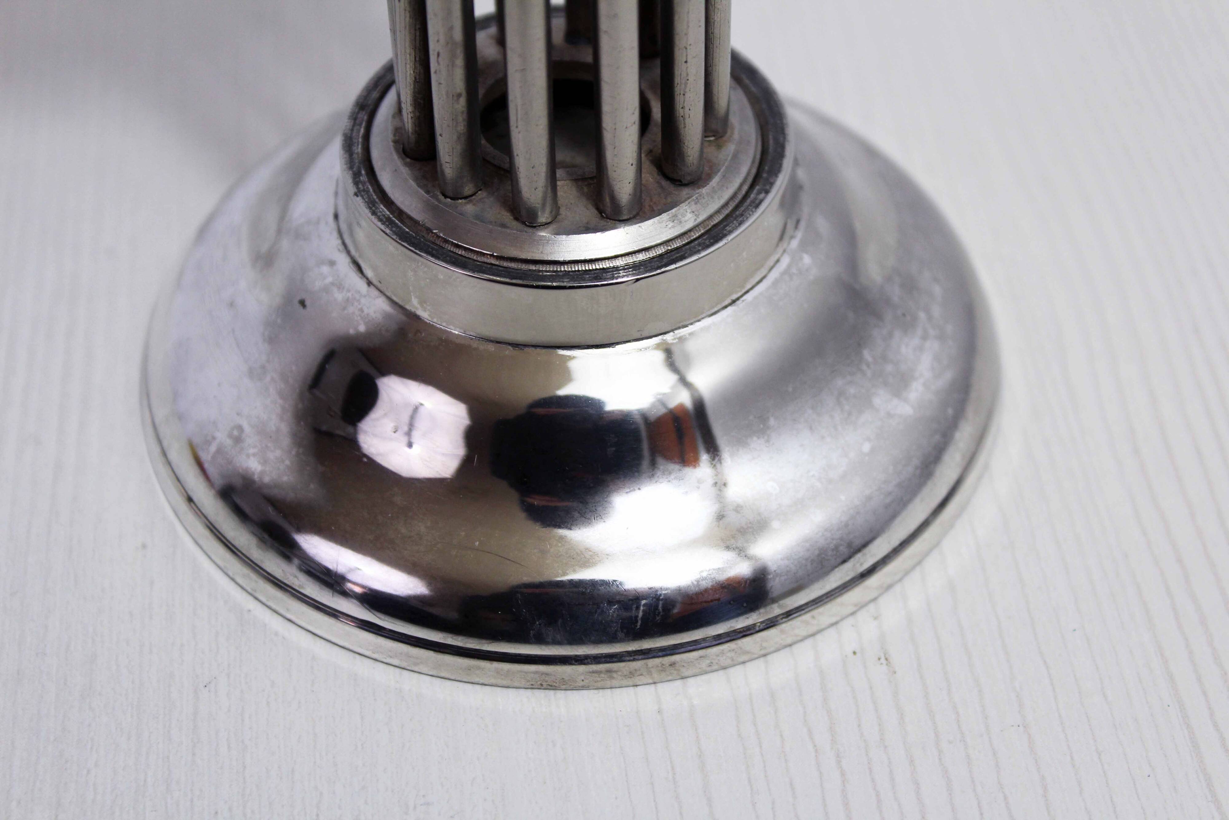 Candle holder in silver metal