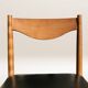 Set of 6 modernist chairs with black faux leather seats.