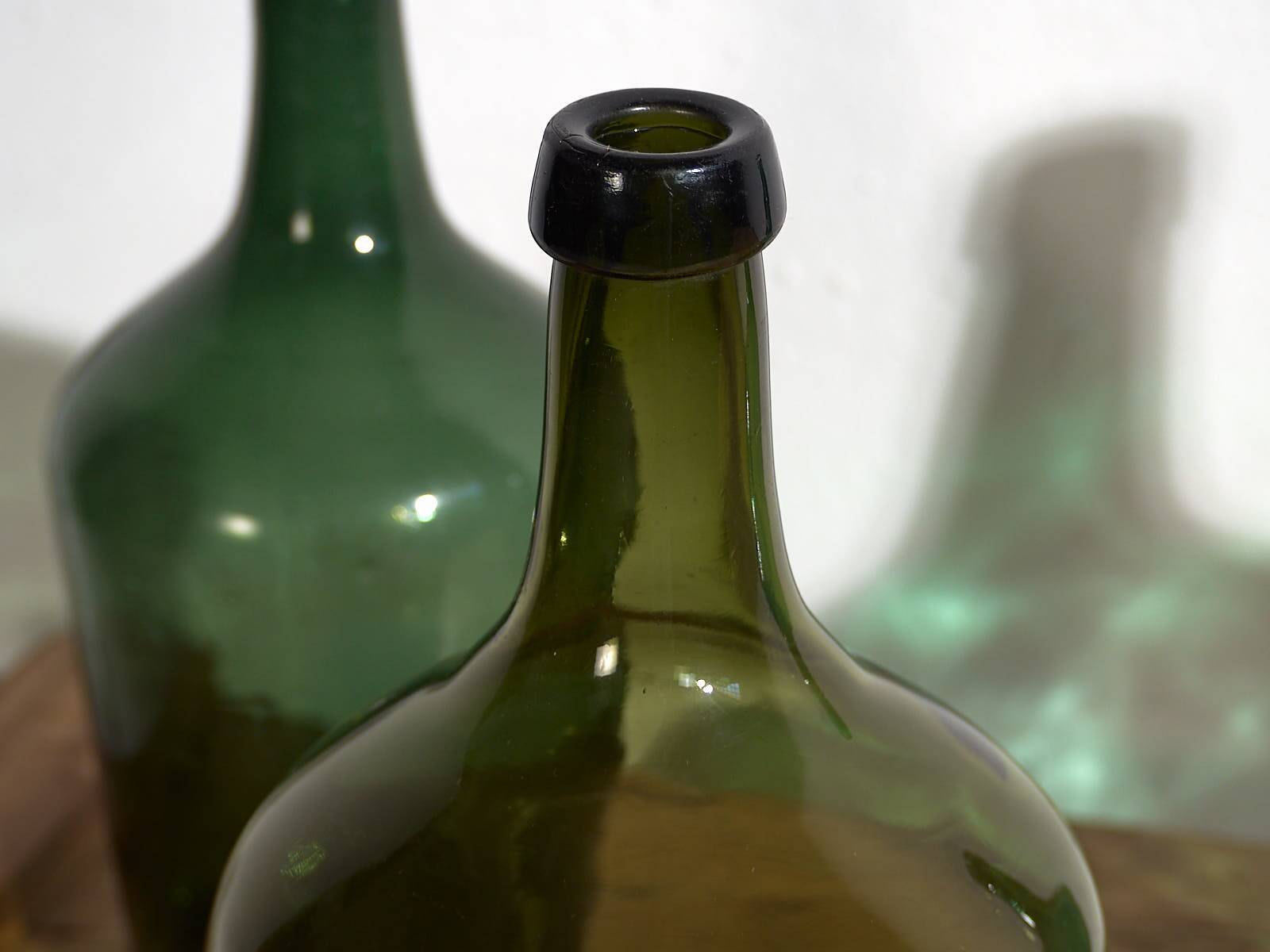 Antique green demijohns (c.1920). Set of 3 pieces