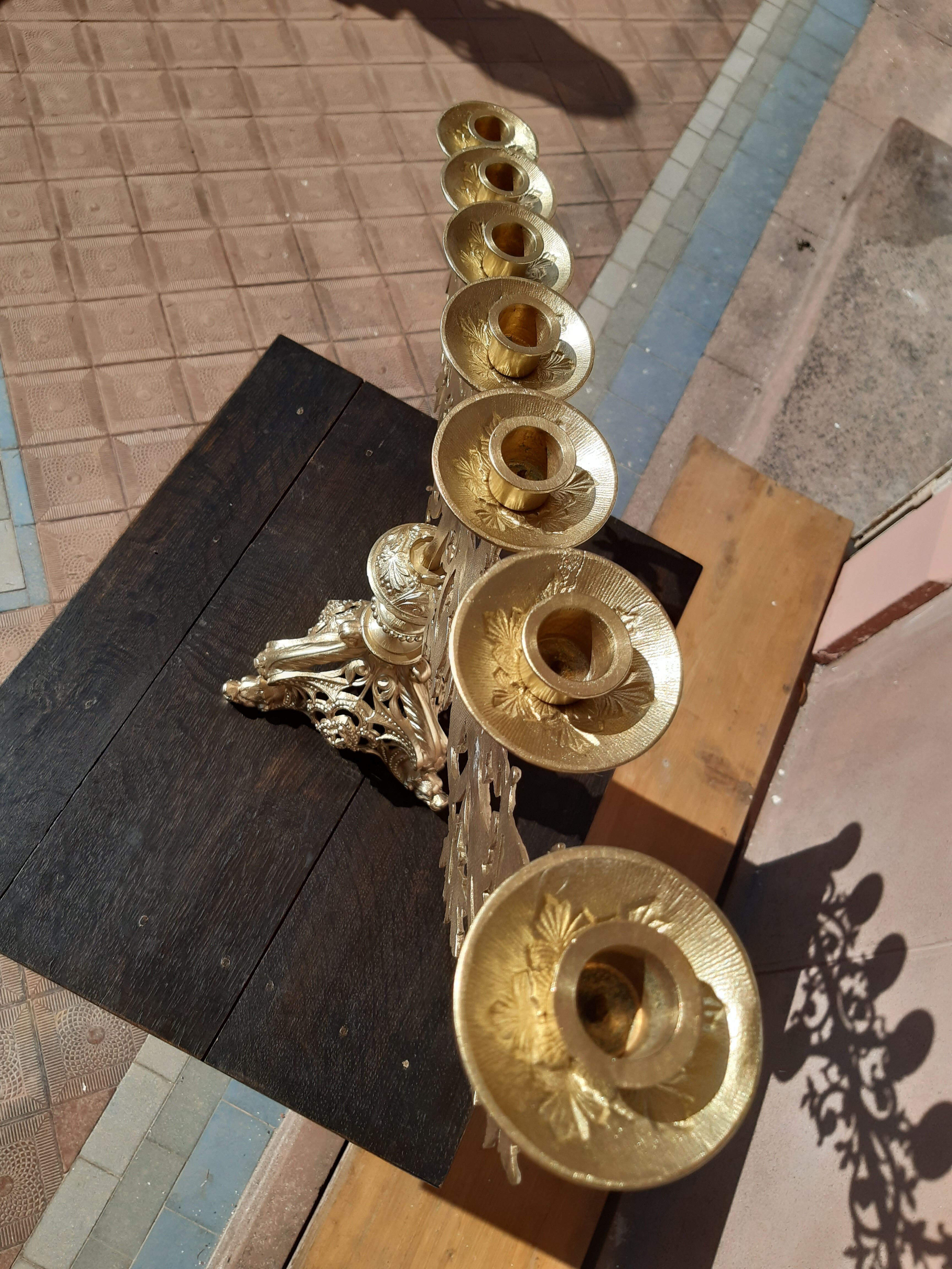 Antique candle holder in bronze and brass nineteenth century.
