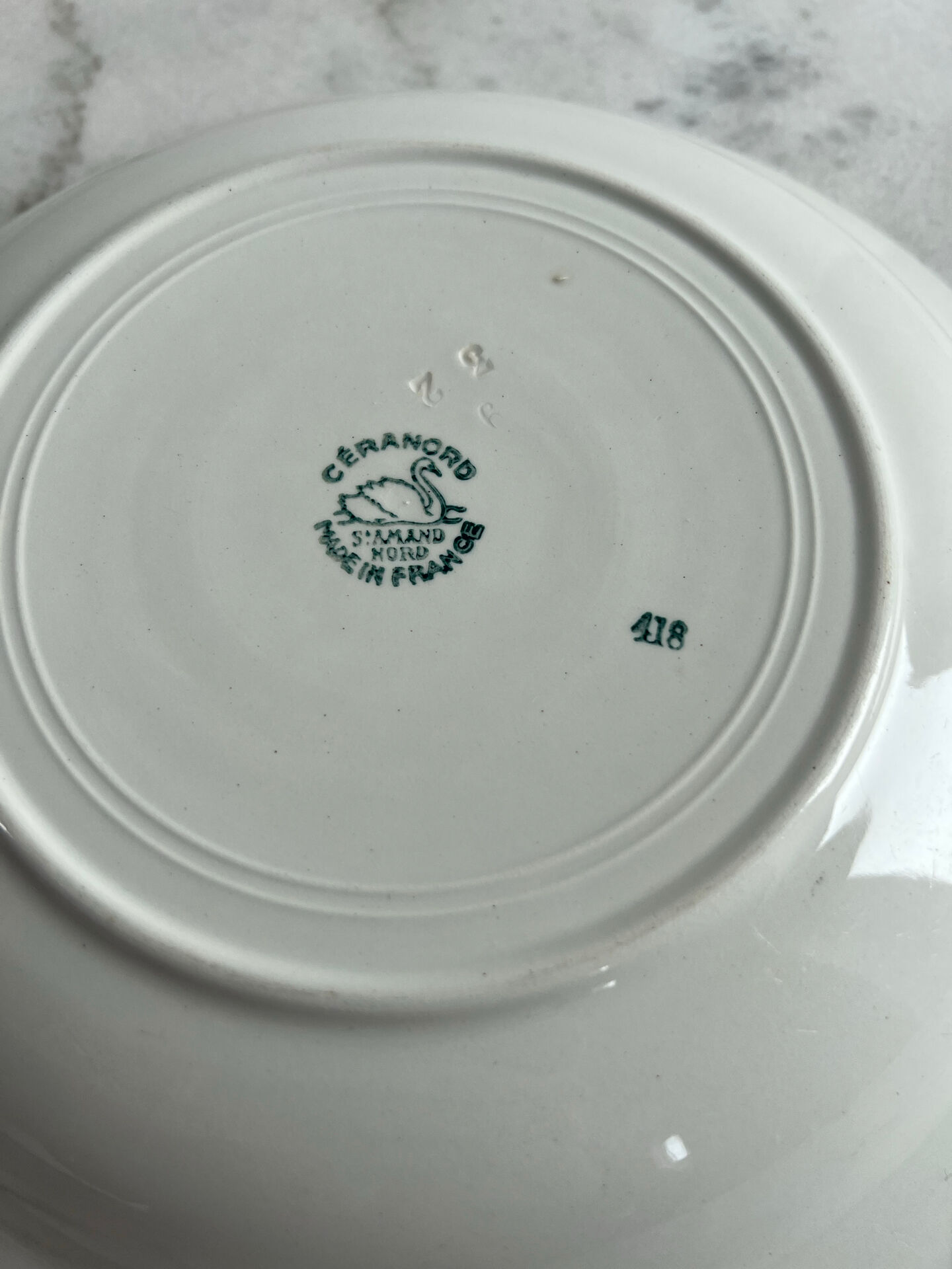 Shallow dish St Amand decorated with green crowns.