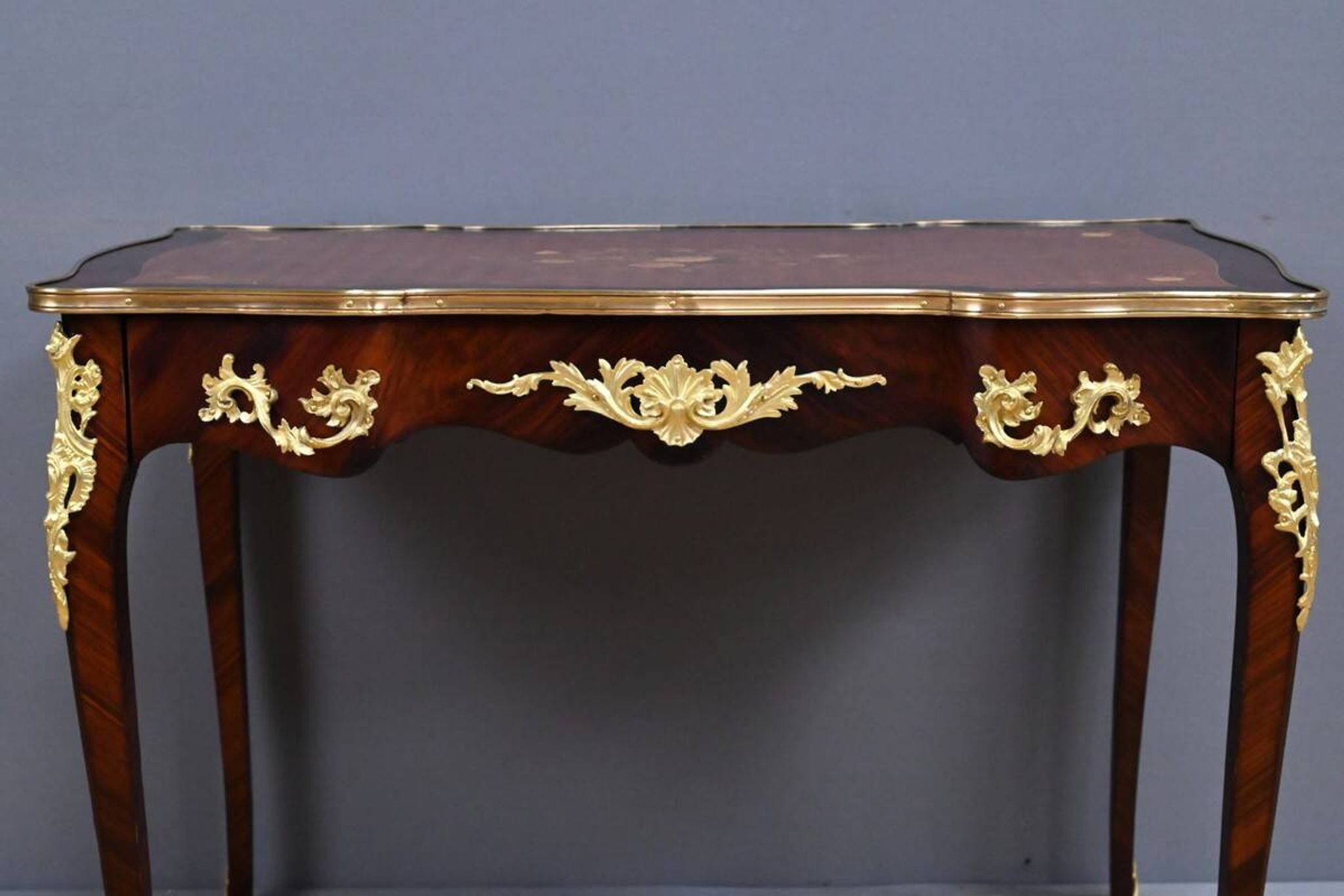 Rosewood, mahogany, and rosewood desk-table, Louis XV style – early 20th century.