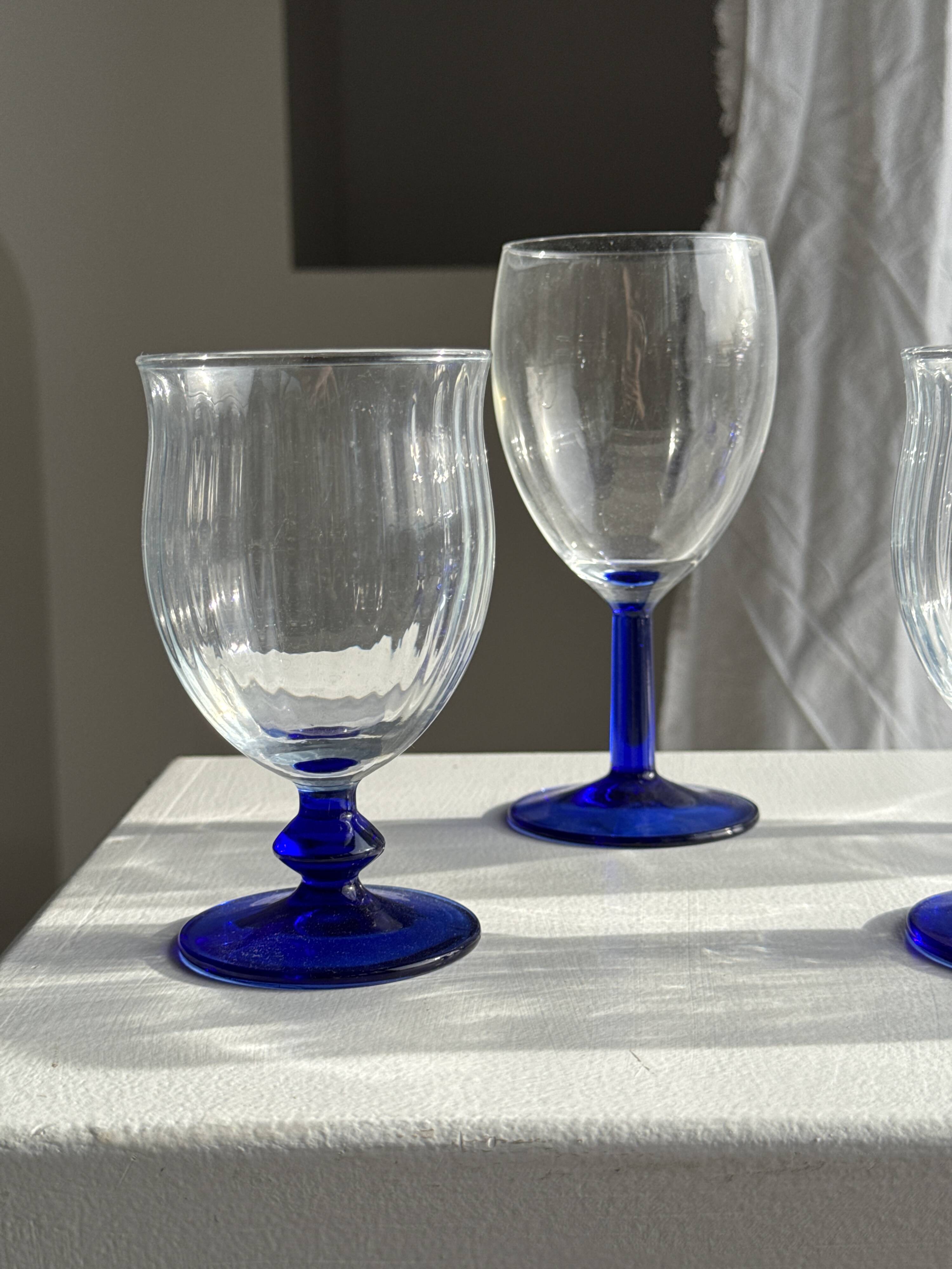 Set of 3 large blue stemmed glasses and 3 small blue stemmed glasses
