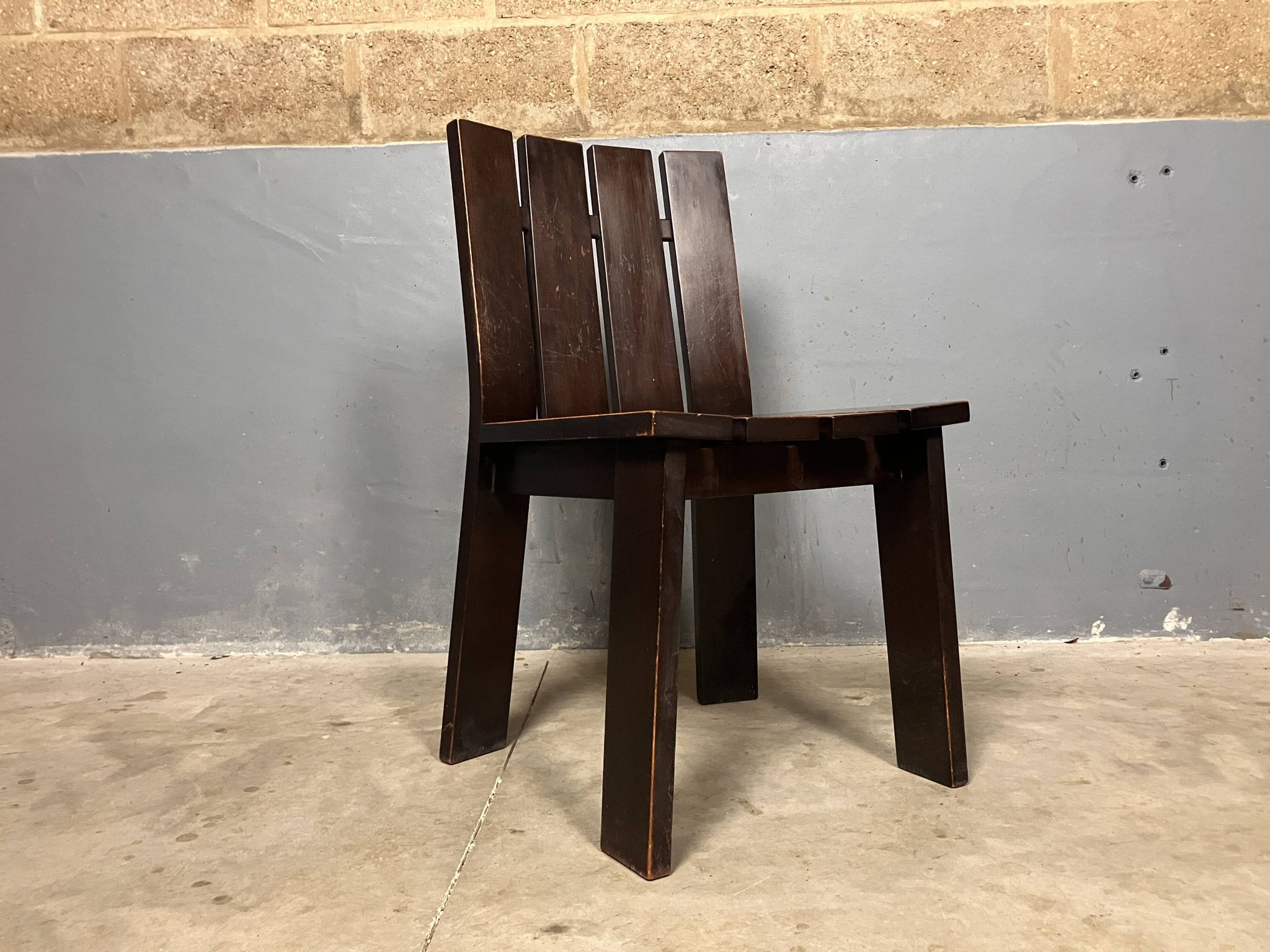 Brutalist and modernist dining chairs from the 1970s in architectural brown wood.