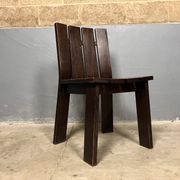 Brutalist and modernist dining chairs from the 1970s in architectural brown wood.
