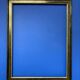 Black and gold frame decorated with Greek frieze decoration